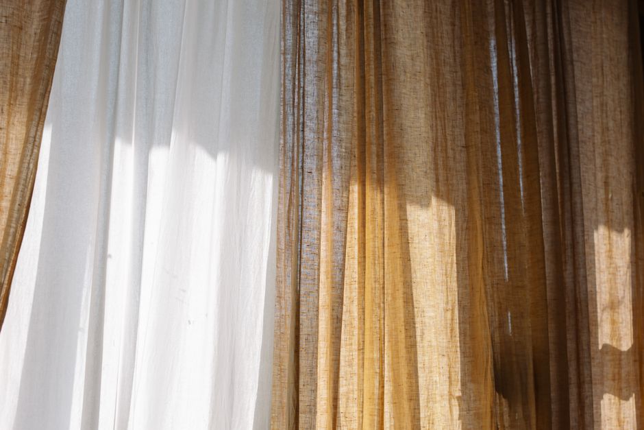 Modern roller shades drawn over a window