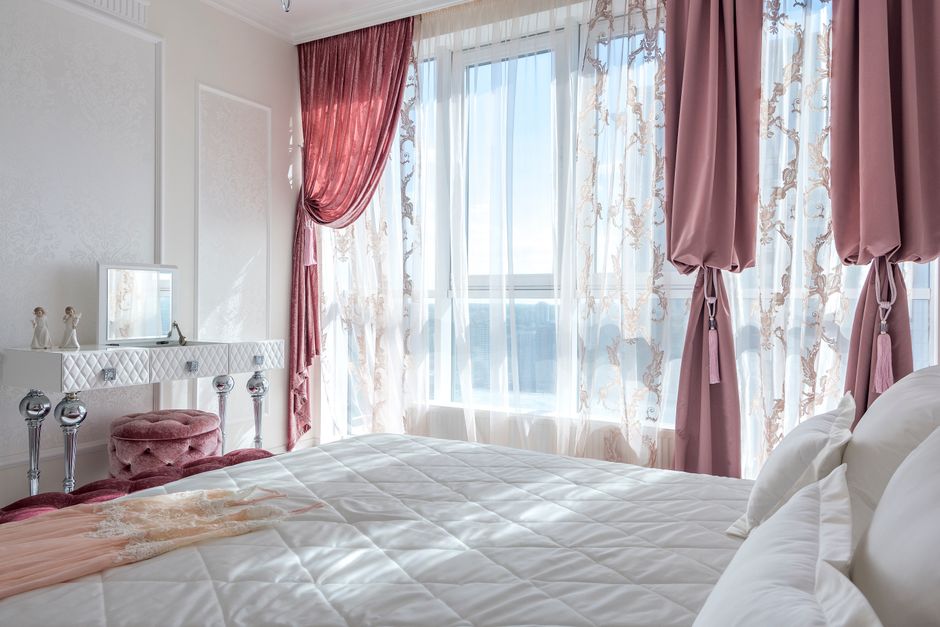 Elegant custom drapes hanging in a living space